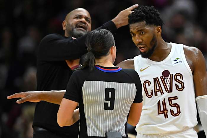Oct 27, 2023; Cleveland, Ohio, USA; Cleveland Cavaliers guard Donovan Mitchell (45) and head coach J. B. Bickerstaff talk to referee Natalie Sago (9) in the third quarter against the Oklahoma City Thunder at Rocket Mortgage FieldHouse.